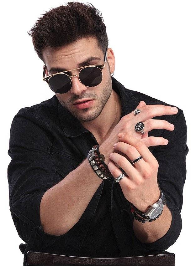 The male model wears watch band and bracelets.